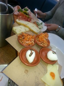 a bad photo of a antipasta platter